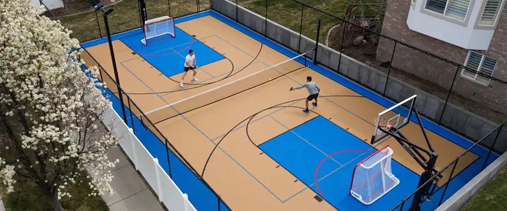 Teenager playing at the backyard pickleball court